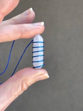 Blue wire wrapped white quartz crystal point necklace